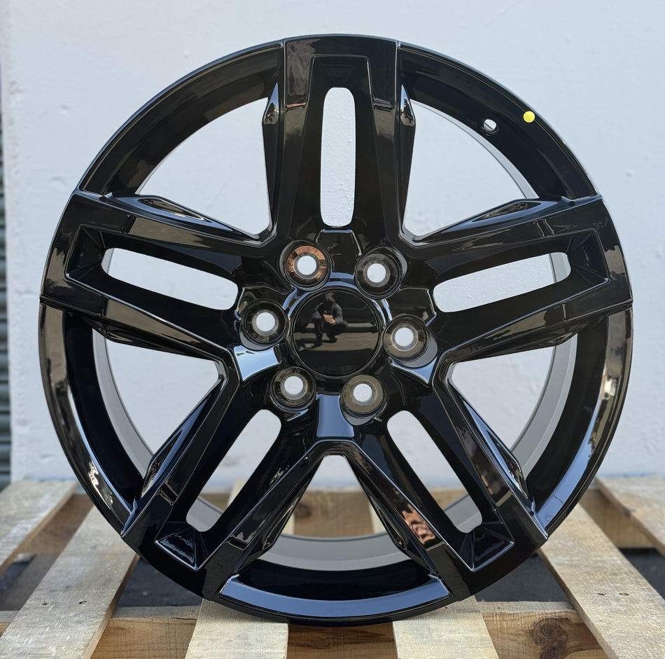 Gloss black 20-inch Trail Boss style wheels by OE Style Wheels on a Cadillac Escalade and Chevy Silverado.