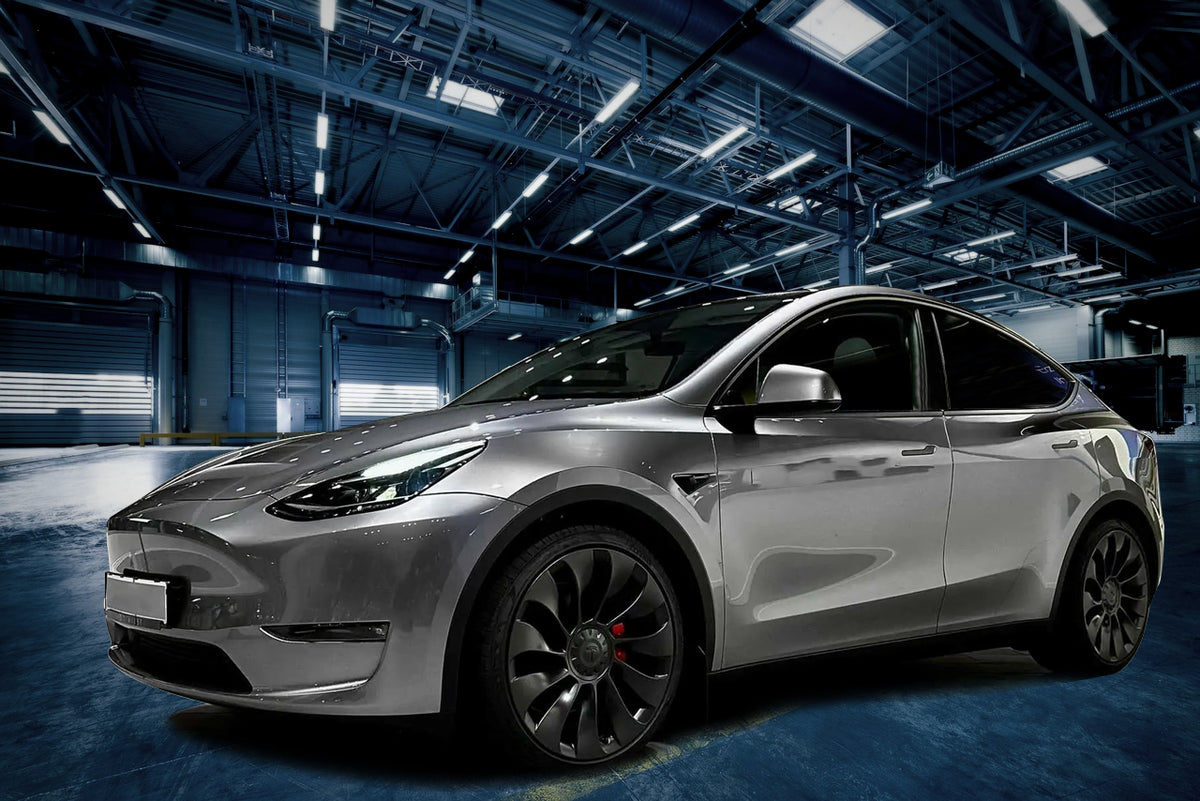 20-inch matte black Überturbine style wheels by OE Style Wheels on Tesla Model 3 and Y, showcasing sleek automotive rims.