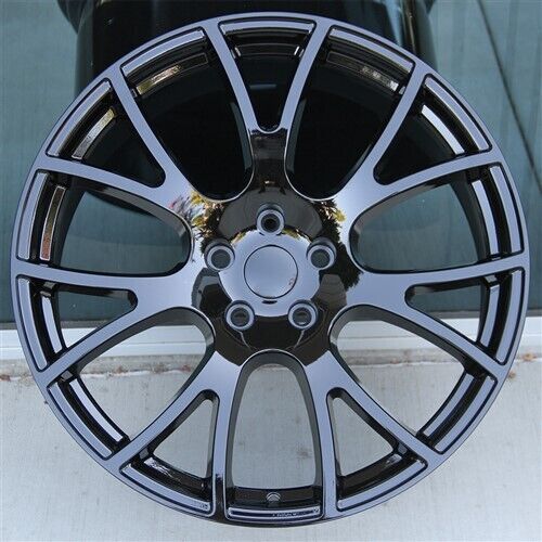 22-inch gloss black mesh style OE Style Wheels on Dodge Durango and Jeep Grand Cherokee, showing sleek automotive rims.