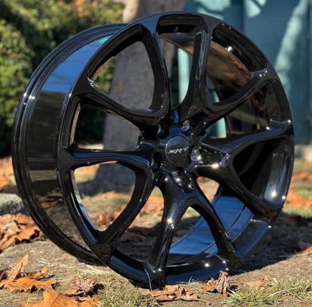22-inch Hellcat style gloss black wheels by OE Style Wheels on Dodge Durango and Jeep Grand Cherokee, showcasing bold automotive rims.