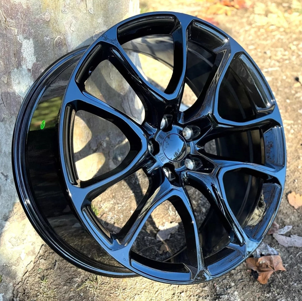 22-inch Hellcat style gloss black wheels by OE Style Wheels, designed for Dodge Durango and Jeep Grand Cherokee SUVs.