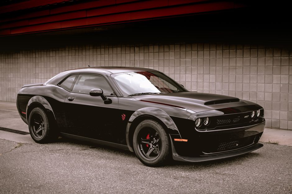 20-inch Demon Style concave wheels by OE Style Wheels on a Dodge Challenger and Charger, showcasing aggressive automotive rims.