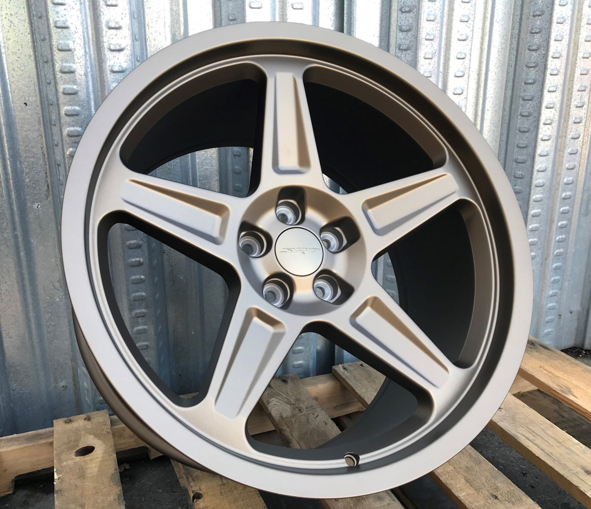 20-inch Demon Style matte bronze wheels by OE Style Wheels installed on a Dodge Challenger and Charger, showcasing aggressive automotive rims.