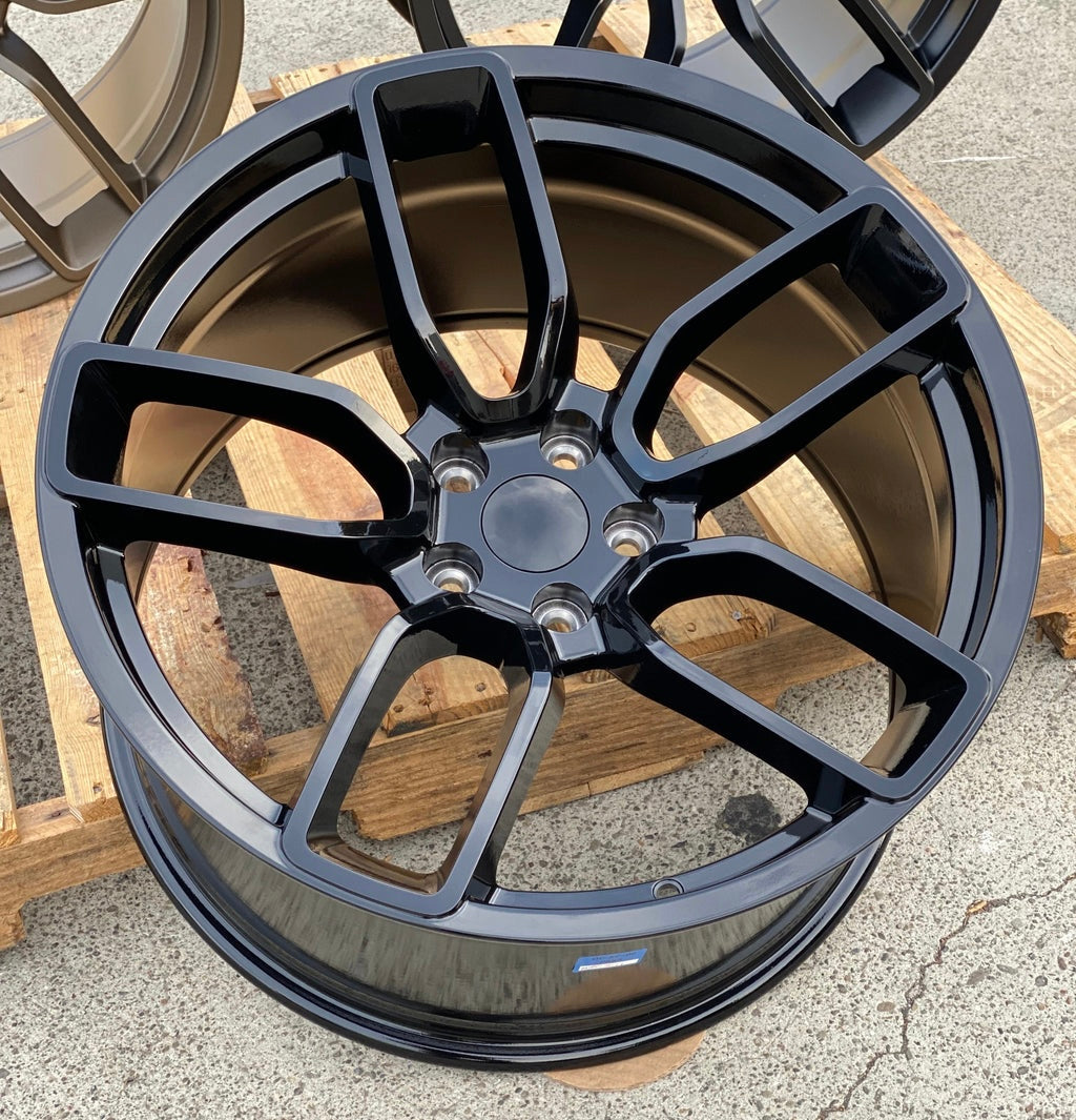 20-inch Hellcat-style gloss black wheels by OE Style Wheels on Dodge Challenger and Charger models with bold, glossy rims.