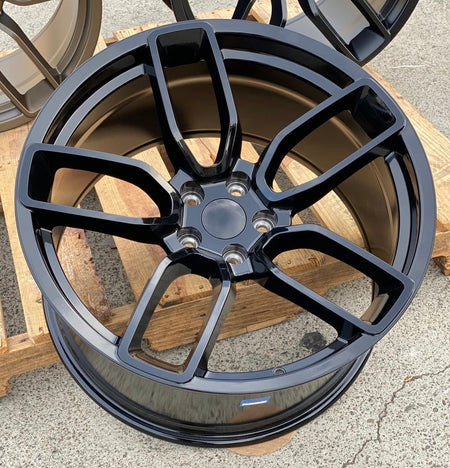 20-inch Hellcat-style gloss black wheels by OE Style Wheels on Dodge Challenger and Charger models with bold, glossy rims.