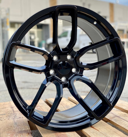 20-inch Hellcat style gloss black wheels by OE Style Wheels on Dodge Challenger and Charger models with sporty design.