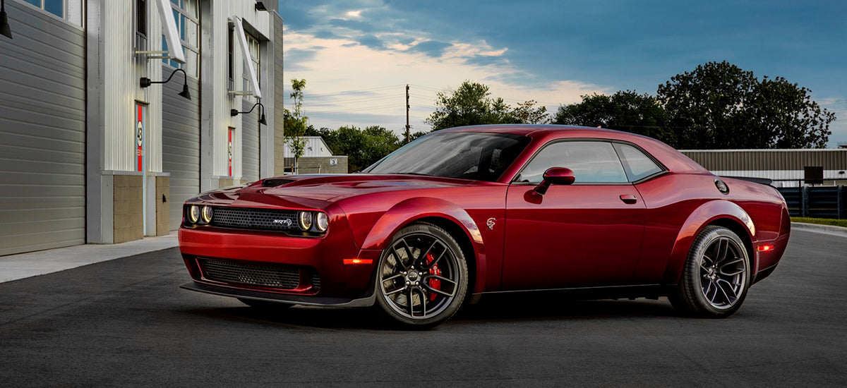 Matte black 20-inch Hellcat style wheels by OE Style Wheels installed on a Dodge Challenger or Charger.