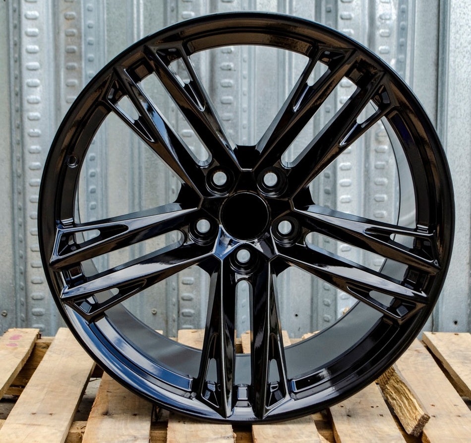 20-inch gloss black ZL1 style wheels by OE Style Wheels, fitting Chevy Camaro ZL1 SS and LT models, shown on vehicle.