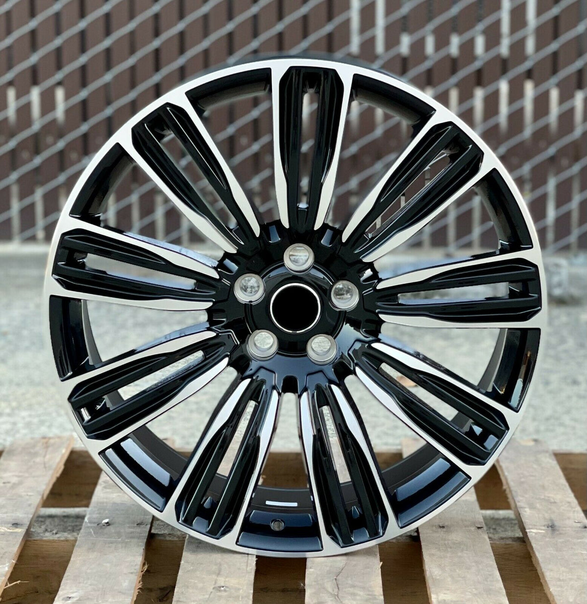 22-inch Black Machined Wheels by OE Style Wheels on Range Rover Evoque and Velar, showing sleek automotive rims with a dynamic style.