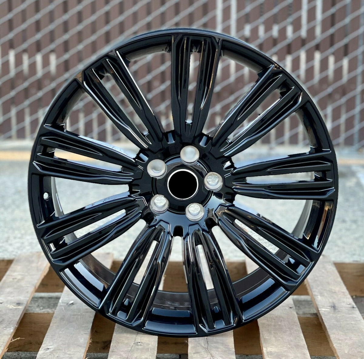 Gloss black 24-inch OE Style Wheels for Range Rover Evoque and Velar, showcasing sleek automotive rims with a dynamic design.